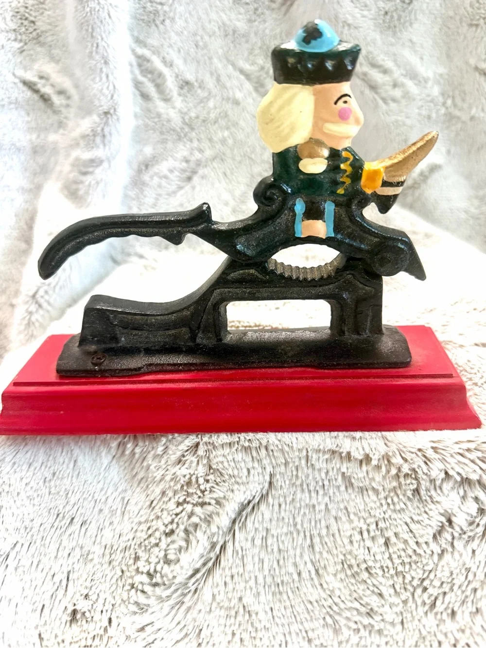 Vintage Cast Iron Nutcracker Figurine on Red Base